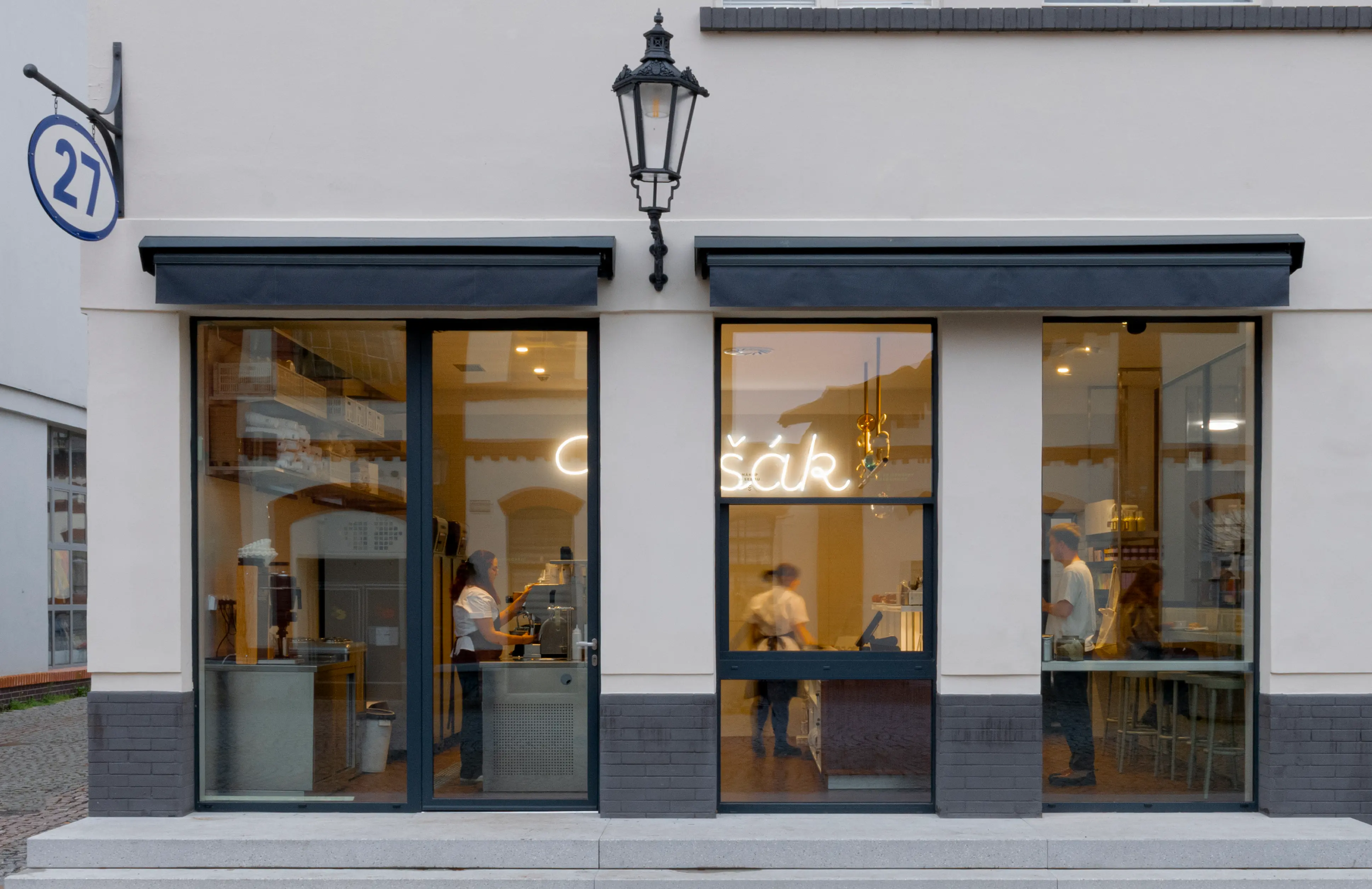 Exterior of Myšák pastry shop at Holešovice Market.